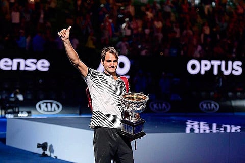 Roger Federer shows up his thumb after winning the Grand Slam