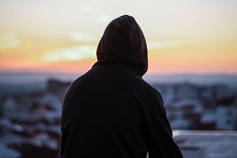 A man sitting on a roof