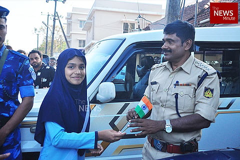 Protesters gift roses and national flags to police during anti-CAA protest in Mangaluru