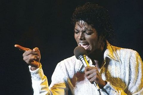 Michael Jackson's estate sues movie memorabilia store for auctioning off historic photos of the star