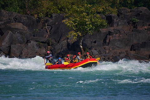 Swaying on a raft, in the waters of the rapids