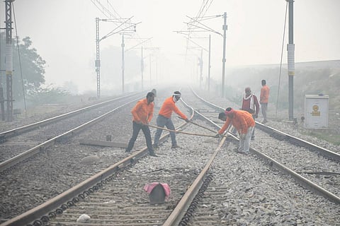 Railway workers repairing a track