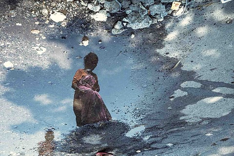 Reflection of a woman in water