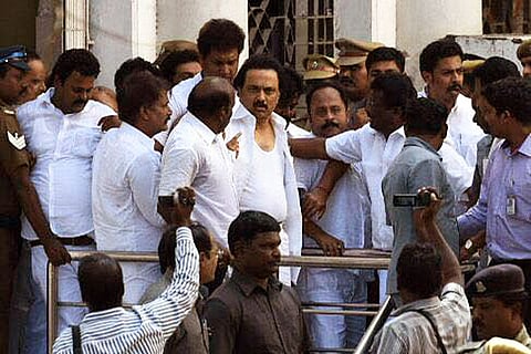 DMK’s surprise drama at TN Assembly: Evicted MLAs complain to Governor, protest at Marina