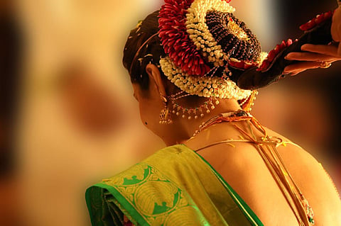 A young woman dressed like a bride