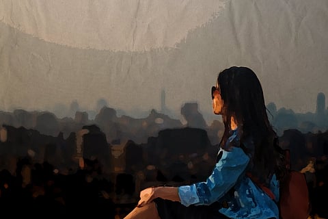 A young girl staring ahead