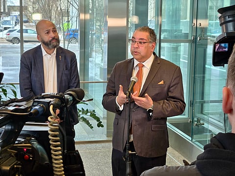 Alberta NDP leader Naheed Nenshi and NDP MLA David Shepherd speak with media at the QEII building in Edmonton on Tuesday
