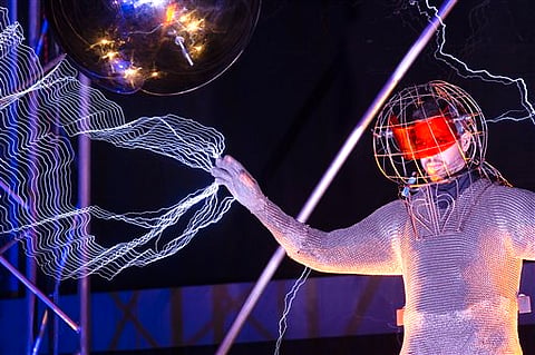 Magician David Blaine stands inside an apparatus surrounded by a million volts of electric currents streamed by tesla coils during his 72-hour "Electrified: 1 Million Volts Always On" stunt on Pier 54, Friday, Oct. 5, 2012, in New York. The stunt, spons