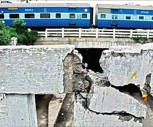 Concrete ripped apart as a result of bursting crackers on the railings of the pedestrian pathway above Egmore down-bridge/P Anand Kumar