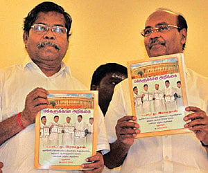 PMK founder Ramadoss (right) releasing a report on the achievements of Prof. Ramadass (left), the sitting Puducherry MP, at Puducherry on Sunday.