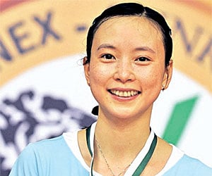 Men’s singles champion Indonesia’s Taufik Hidayat and women’s singles winner France’s Hongyan Pi with their medals in Hyderabad on Sunday.