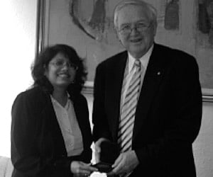 Malini Laloraya receiving the Raine Visiting Professor medallion from Professor Alan Robson, Vice-Chancellor, UWA, Perth.