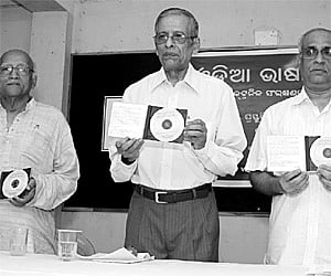 (From left) Linguist Prof Debiprasanna Patnaik, Prof Amulya Kumar Panda and Development Commissioner Tarun Kanti Mishra release a CD - Oriya Language