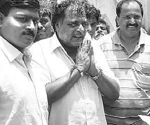 Ambareesh, the Congress candidate for Mandya, interacting with voters at Marasignahalli on Saturday.