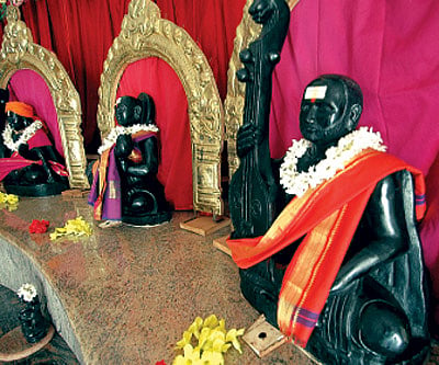 PAGODA OF MELODY: (Clockwise from top right) The Saptaswara Devatha Dhyana Mandira modelled in the shape of the tambura; a statue of instrumentalist H