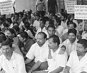 BJD activists stage dharna near PMG Square in Bhubaneswar on Wednesday protesting alleged favouritism by the Chief Electoral Officer.