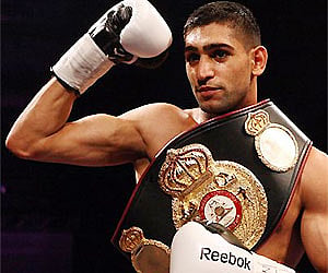 Britain's Amir Khan, celebrates his victory over Dmitriy Salita, of the US at the end of their boxing match in Newcastle. AP