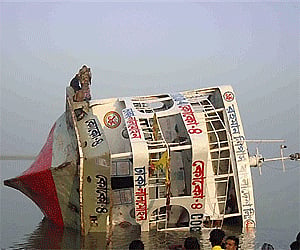 The triple-deck ferry, M.V. Coco, floats after it tipped and its rear portion sank in the Tetulia River late Friday near Bhola, Bangladesh. AP