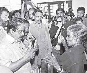 Revenue Minister K P Rajendran interacting with the inmates of the relief camp at Government L P School, Mothakkara, in Mananthavadi taluk, Wayanad