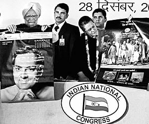 Prime Minister Manmohan Singh and Congress president Sonia Gandhi release posters at the 125th foundation day function of the party in New Delhi.