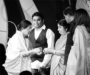 Noted playback singer P Susheela (left) presenting Rahman’s mother Karima Begum with bangles on the eve of in Mother’s Day.