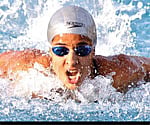 SUPER TEEN: Arhata Magavi of Karnataka on her way to setting a record in the 100m butter fly stroke in the 63rd Senior National Aquatic Championship.