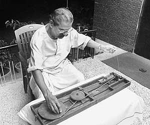 Antony Chittattukkara with Gandhiji’s foldable charkha.