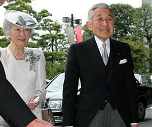 Emperor Akihito and Empress Michiko at the National Theater in Tokyo to attend a ceremony in commemoration of the 20th anniversary of the emperor's co