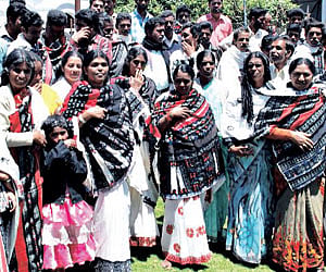 Toda tribes staging a demonstration against a private TV channel outside the Collectorate in Udhagamandalam.