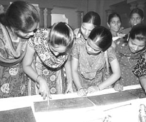 Students looking at the rare manuscripts that were exhibited at the Arts College of Osmania University on Thursday.