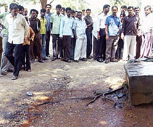 The spot where Chetan (23), was found murdered in the backyard of a hotel at Peenya 2nd stage in Bangalore on Wednesday night. (Top) Chetan