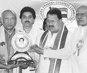 Chief Minister K Rosaiah presenting Kommineni Seshagiri Rao Memorial Award to Legislative Council chairman K Chakrapani in Hyderabad on Tuesday. PCC
