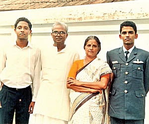 Wing Commander S Sajan with his family members; and Sajan on board SU-30MKI.
