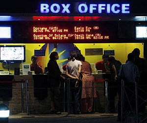 People buy tickets at a counter in a multiplex movie theatre in Mumbai in this November 2008 (File photo / Reuters)