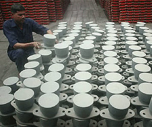 A labourer works inside an iron factory in Lucknow in this July 18, 2009 file photo.REUTERS
