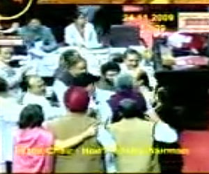 Rajya Sabha MPs scuffling in the House after the Liberhan Commission report was tabled. (TV grab)