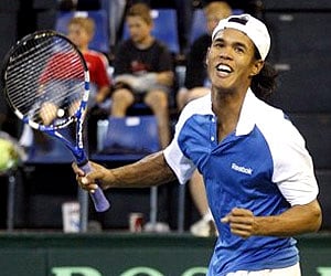 Somdev Devvarman reacts after scoring a match point against SA's Rik De Voest, during the Davis Cup world group play-off match in Johannesburg. (AP)