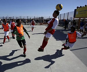 School children run for the ball during a soccer coaching clinic situated on the outskirts of Cape Town, South Africa on Monday. (AP)