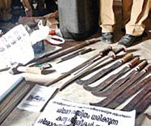 Weapons and posters recovered by the police from Edakkad on Monday.