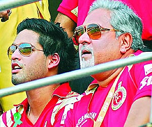 Siddharth Mallya and father Vijay in RCB colours. (File photo: EPS)