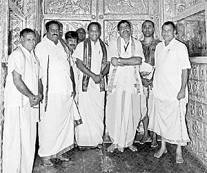 TTD officials standing before the Srivari temple in Tirumala on Saturday which was closed on account of the lunar eclipse. | Express Photo
