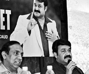 Malabar Gold director Ravi Pillai, actor and Malabar Gold brand ambassador Mohanlal and Malabar Group of Companies chairman M.P.  Ahammed at the news