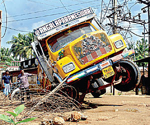 Poor road conditions damage the rear axle of a lorry, which was transporting sand, at Madipakkam on Wednesday.