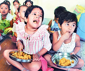 Children having food at an Anganwadi centre at Rajajinagar in Bangalore | EPS