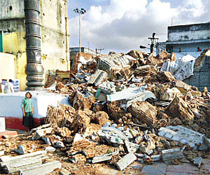 The Gali Gopuram of the Sri Bhavanarayana temple lies in ruins at Bapatla on Sunday. | Express Photo