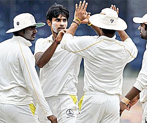 Jagannathan Kaushik (centre) took 28 wickets in his debut Ranji season.