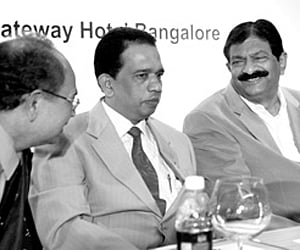B N Bachegowda, Labour Minister, PD Shenoy, Former Labour Secretary, Vasanth Kumar Kamila, Chairman, NIPM at a national seminar | EXPRESS PHOTO