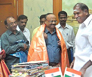 Top accolade: Indran being felicitated by Chief Minister N Rangasamy, in Puducherry on Monday.