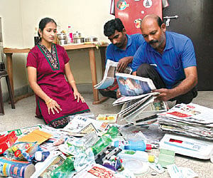 Employees from Kuppathotti.com collecting waste from a client's house | EPS