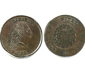 This undated photo provided by Heritage Auctions shows the front and back of one of the first pennies struck at the United States Mint | AP
